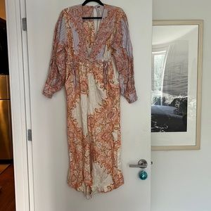 Free people jumpsuit, size XS but runs a little oversized